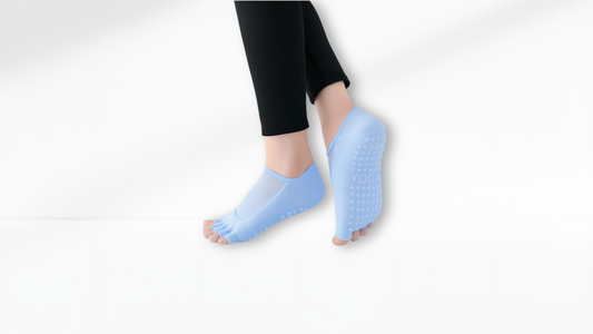 Person wearing blue toe Mesh Grip separators on a white background