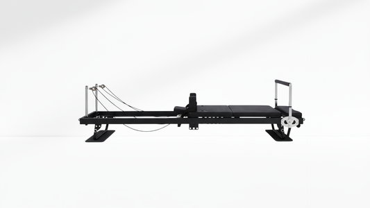 Black Pilates reformer core on a white background