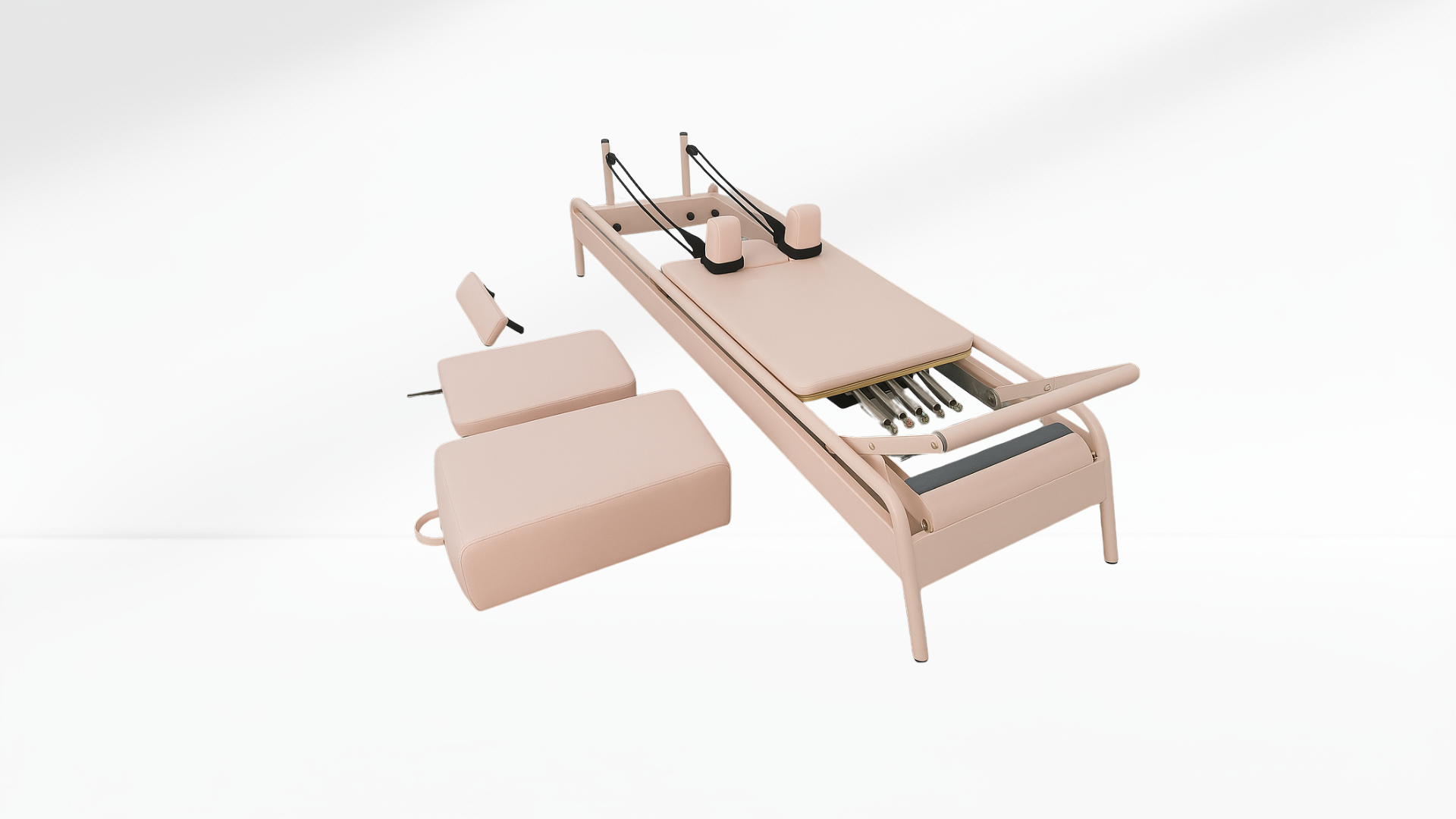 Beige Pilates reformer with accessories on a white background