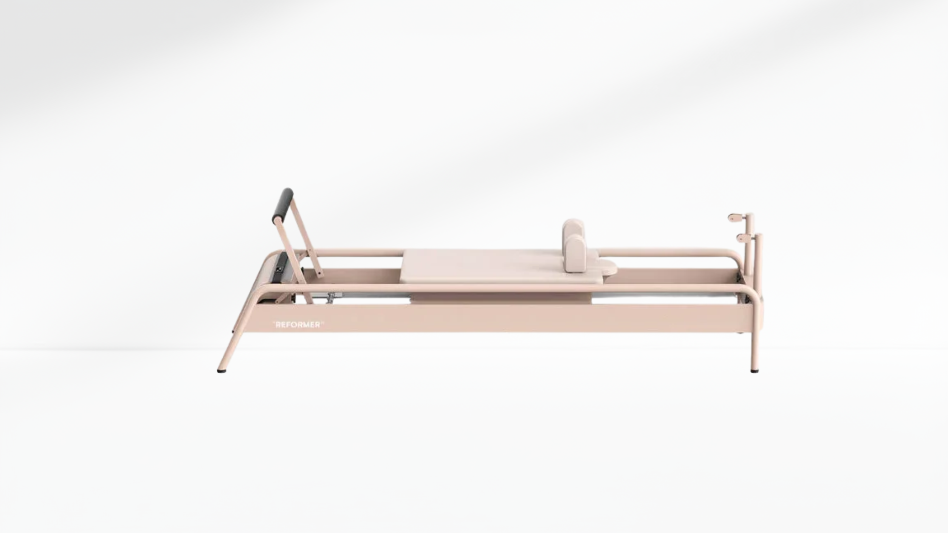 Beige pilate reformer metal on a white background
