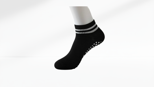 Black ankle grop sock with white stripes on a white background