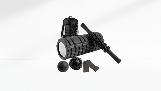 Black foam roller massage set with textured roller, massage stick, spiky ball, smooth ball, resistance band, and carrying bag displayed on a white background.