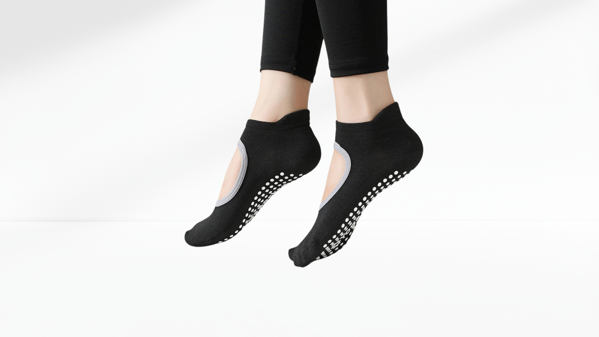 Black grip socks with non-slip sole on a white background