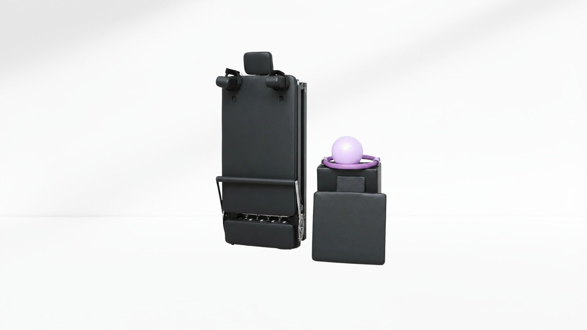 Black pilates reformer with a purple light on a white background