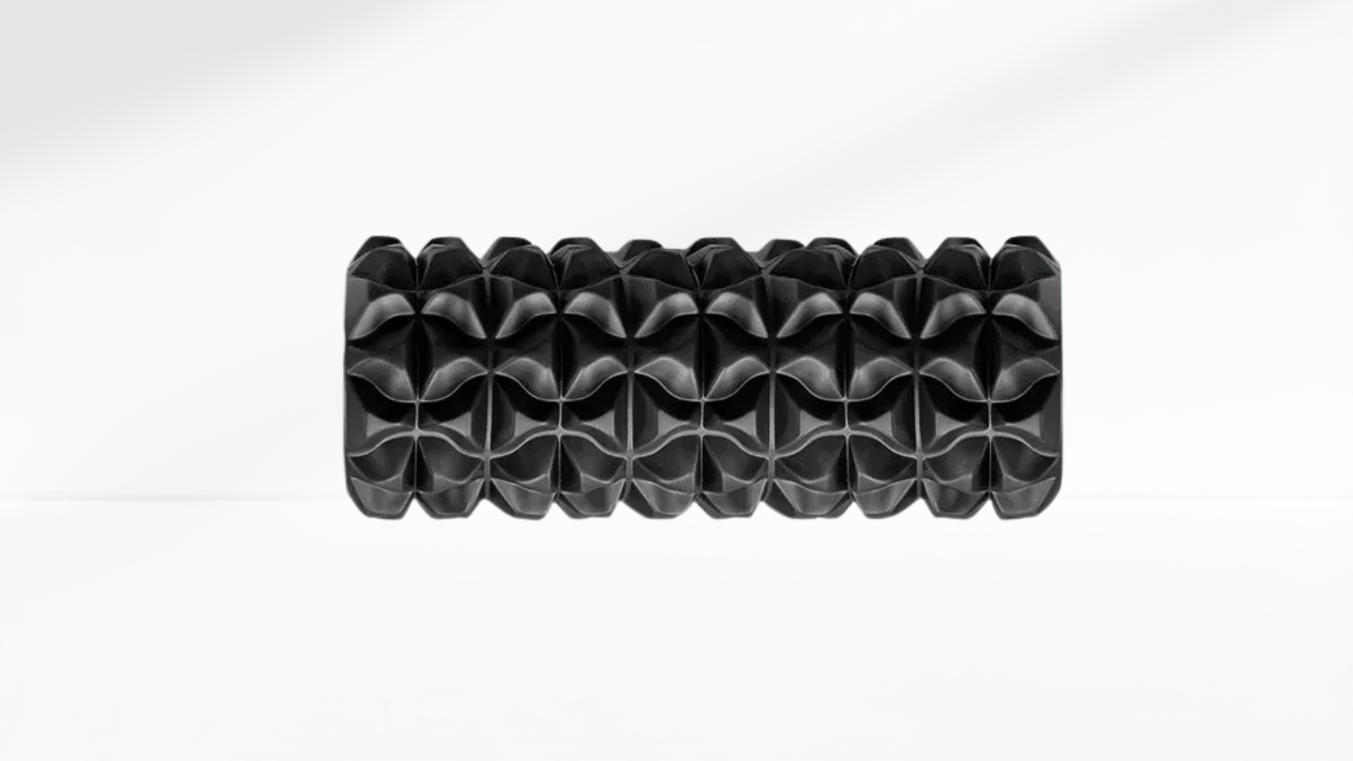 Black textured Electric Vibrating Foam Roller on a white background