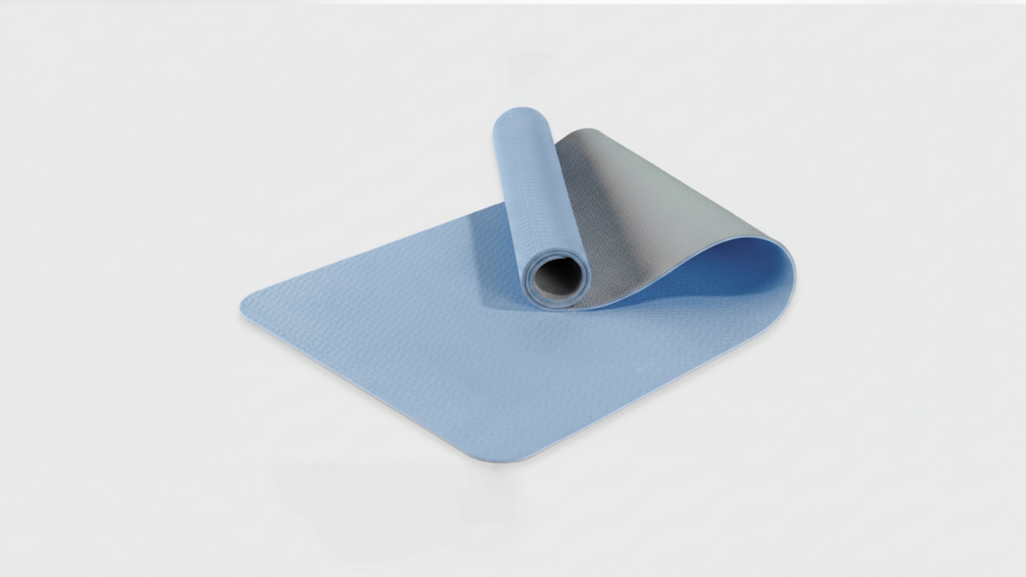 Blue yoga mat on a light gray background