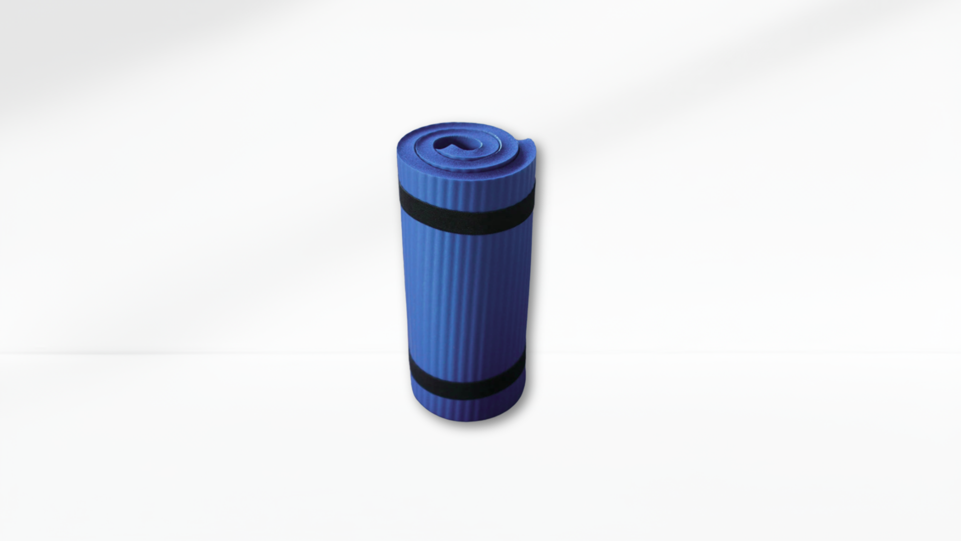 Blue yoga mat with black bands on a white background