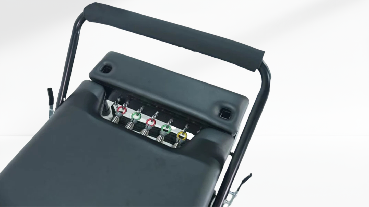 Close-up of a mechanical Pilates Reformer – Foldable with Box with various connectors on a white background