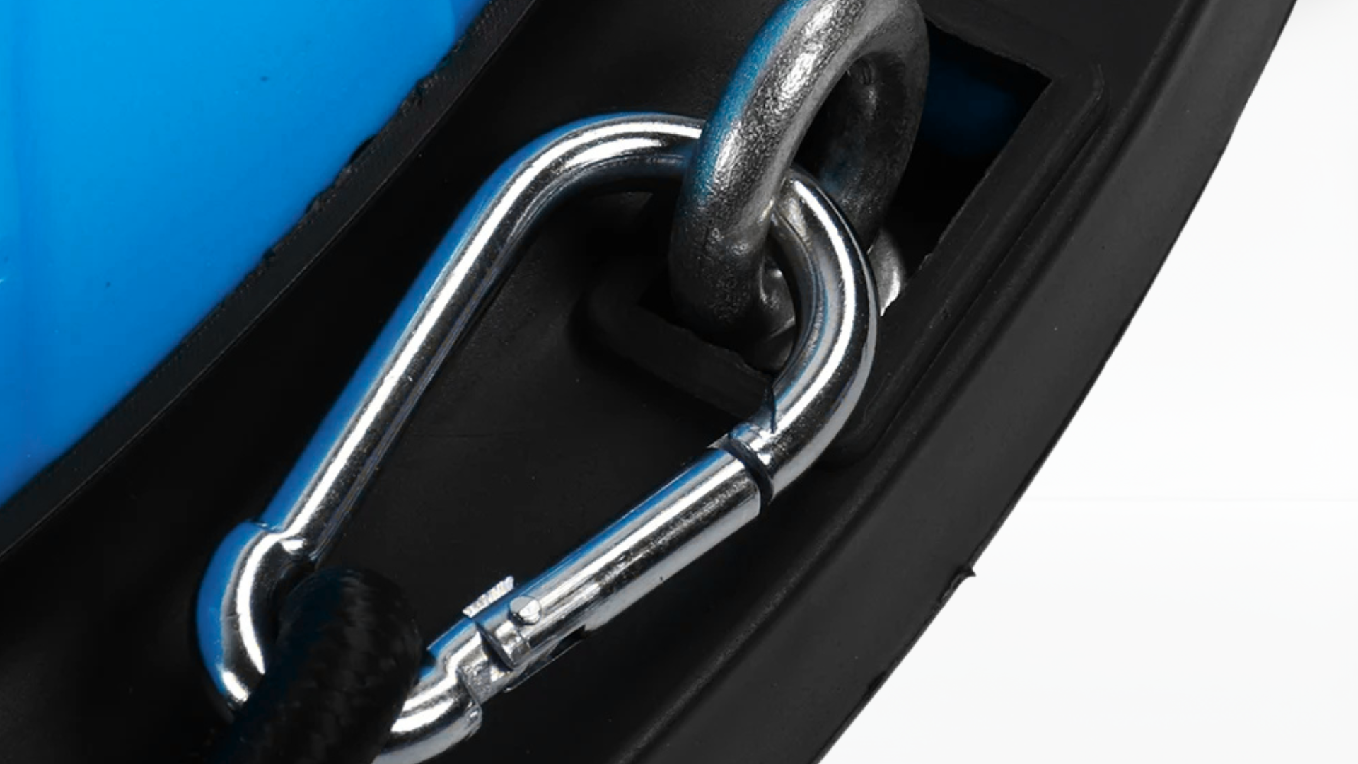 Close-up view of the metal carabiner attachment on a blue  trainer balance ball.