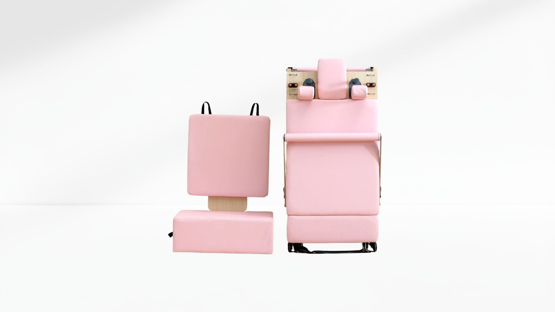 Set of pink folding pilates machine on a white background