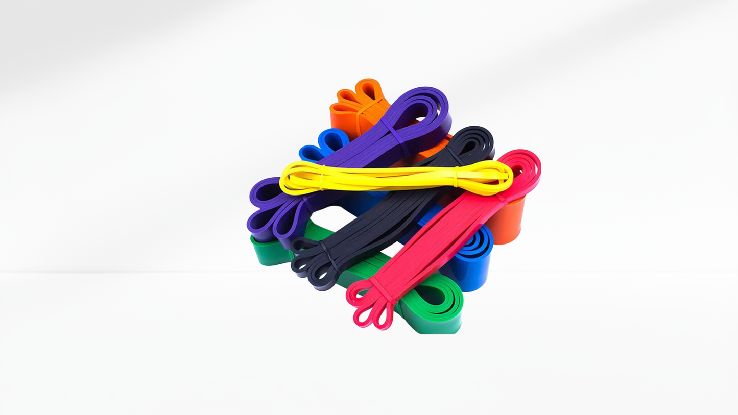 Colorful resistance bands stacked on a white background