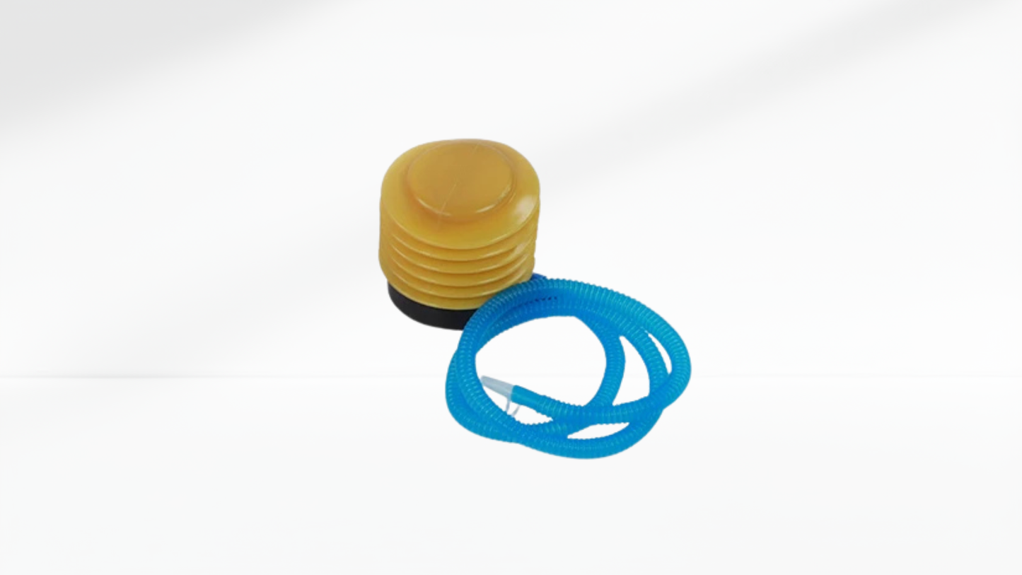 Yellow foot pump with blue air hose for inflating a trainer balance half ball.