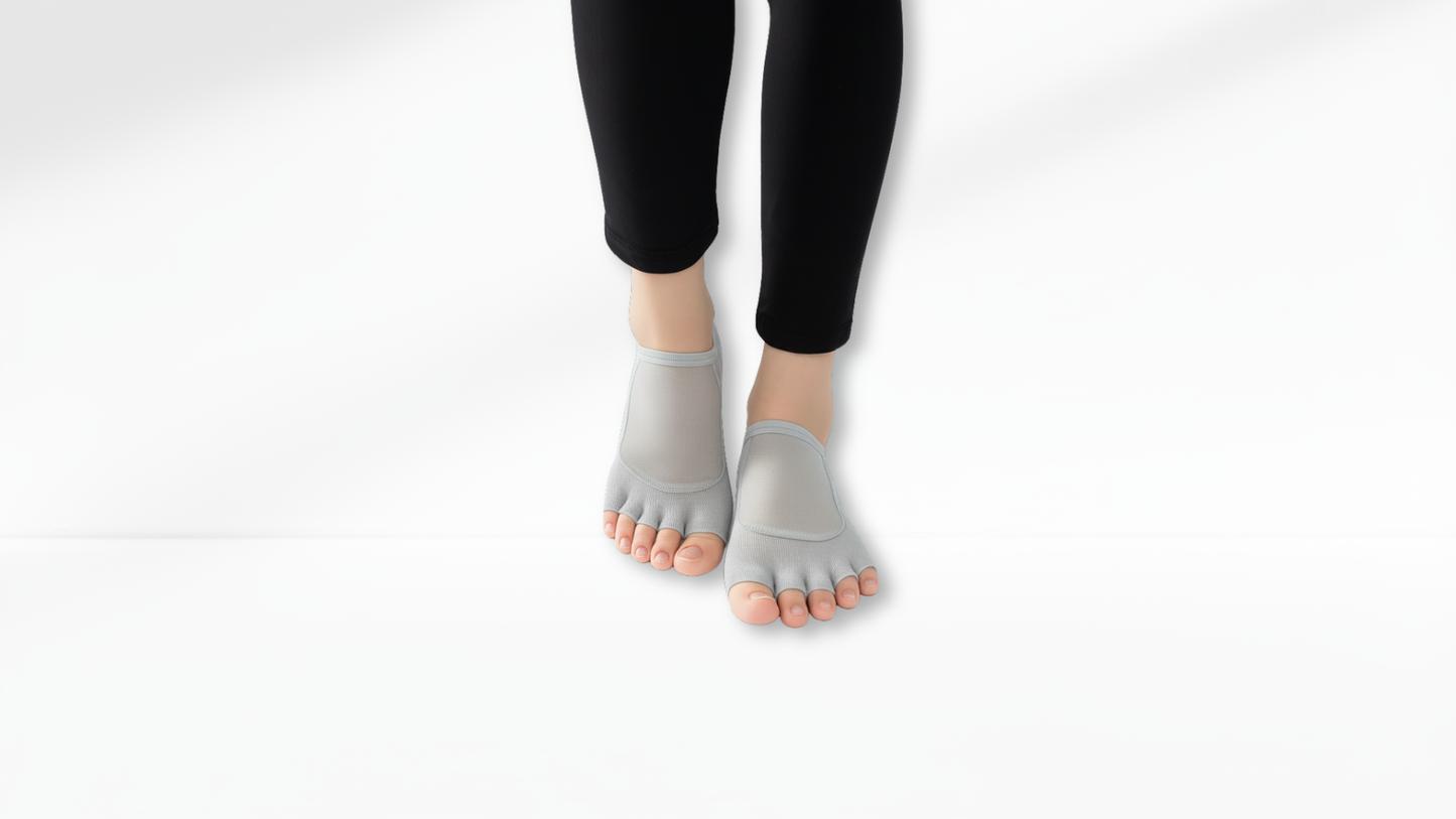 Gray Toe Socks Mesh Grip worn with black leggings on a white background