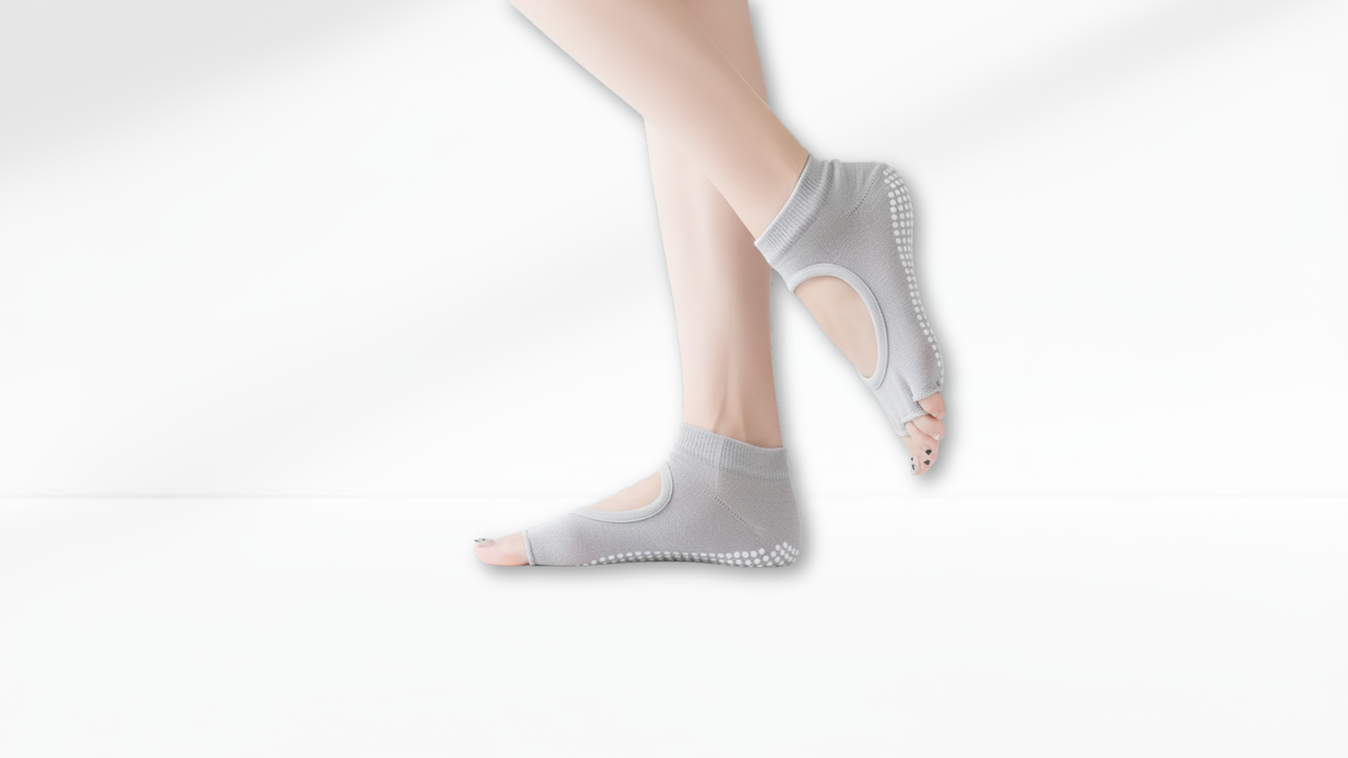Gray Toe Socks – Open Cut Grip by a person on a white background