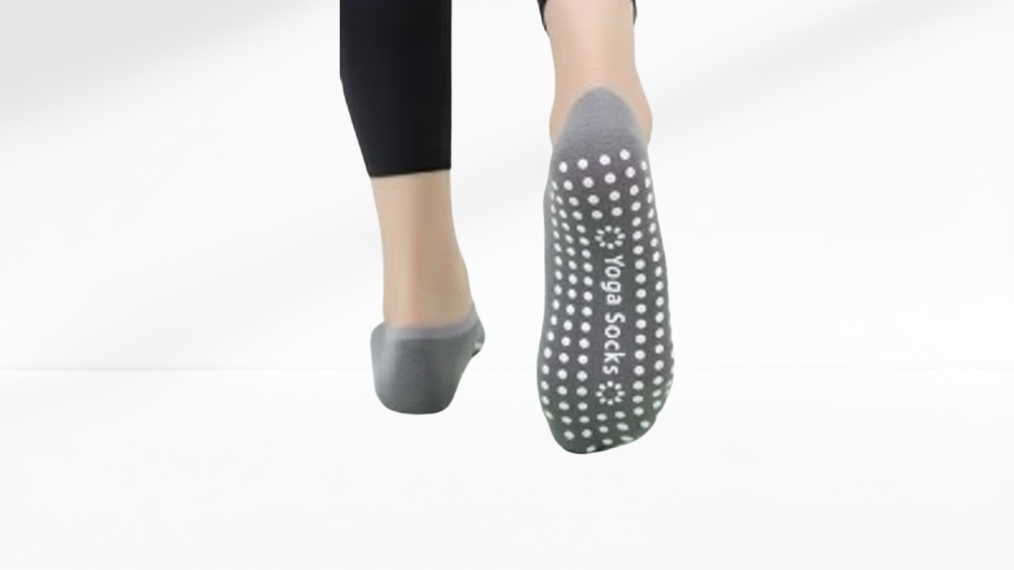 Gray grip socks ballet with textured sole on a white background