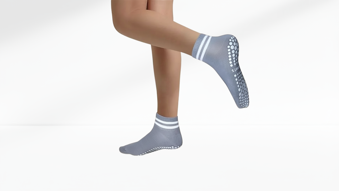 Gray grip socks with striped patterns on a white background