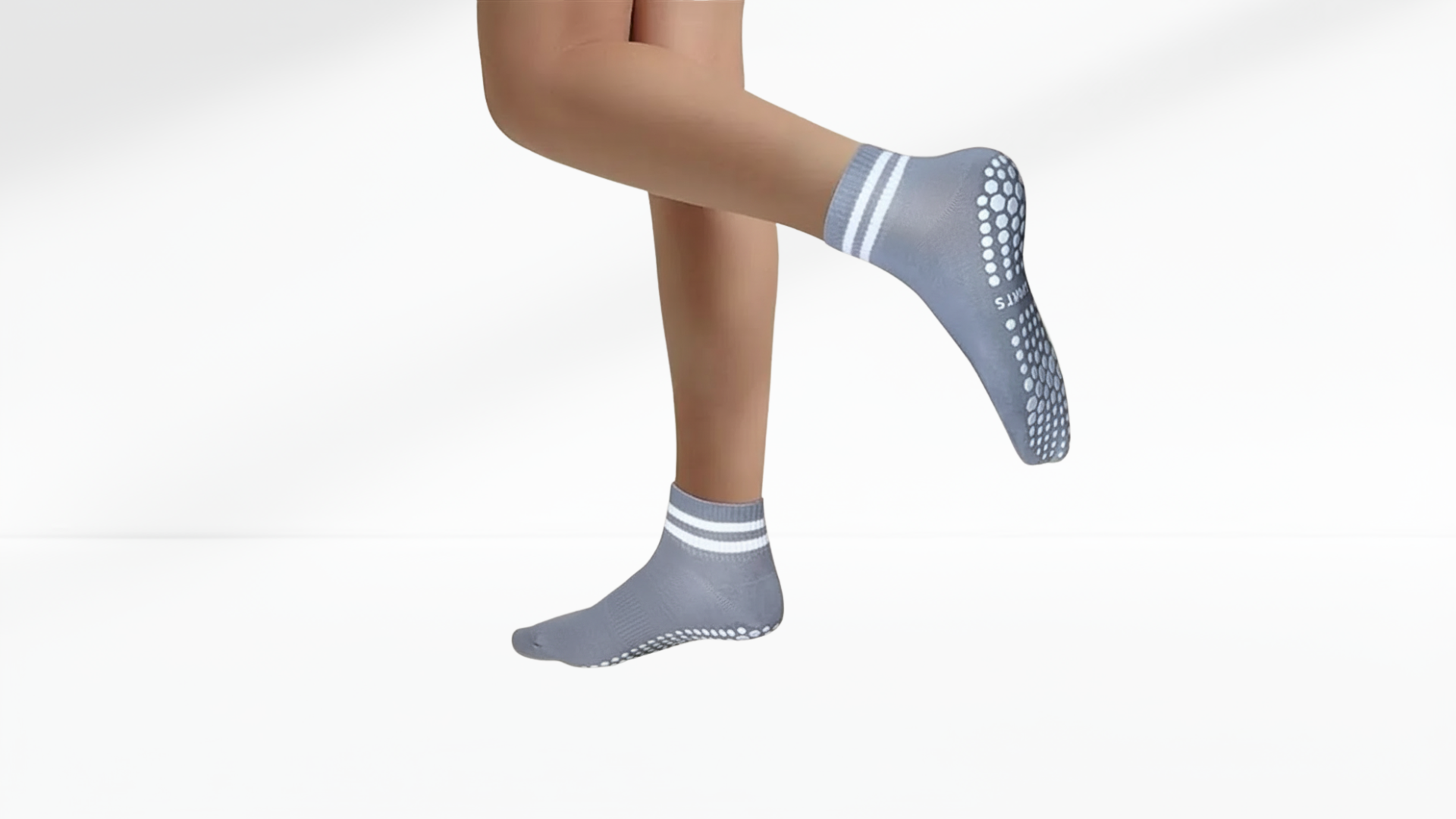 Gray grip socks with striped patterns on a white background
