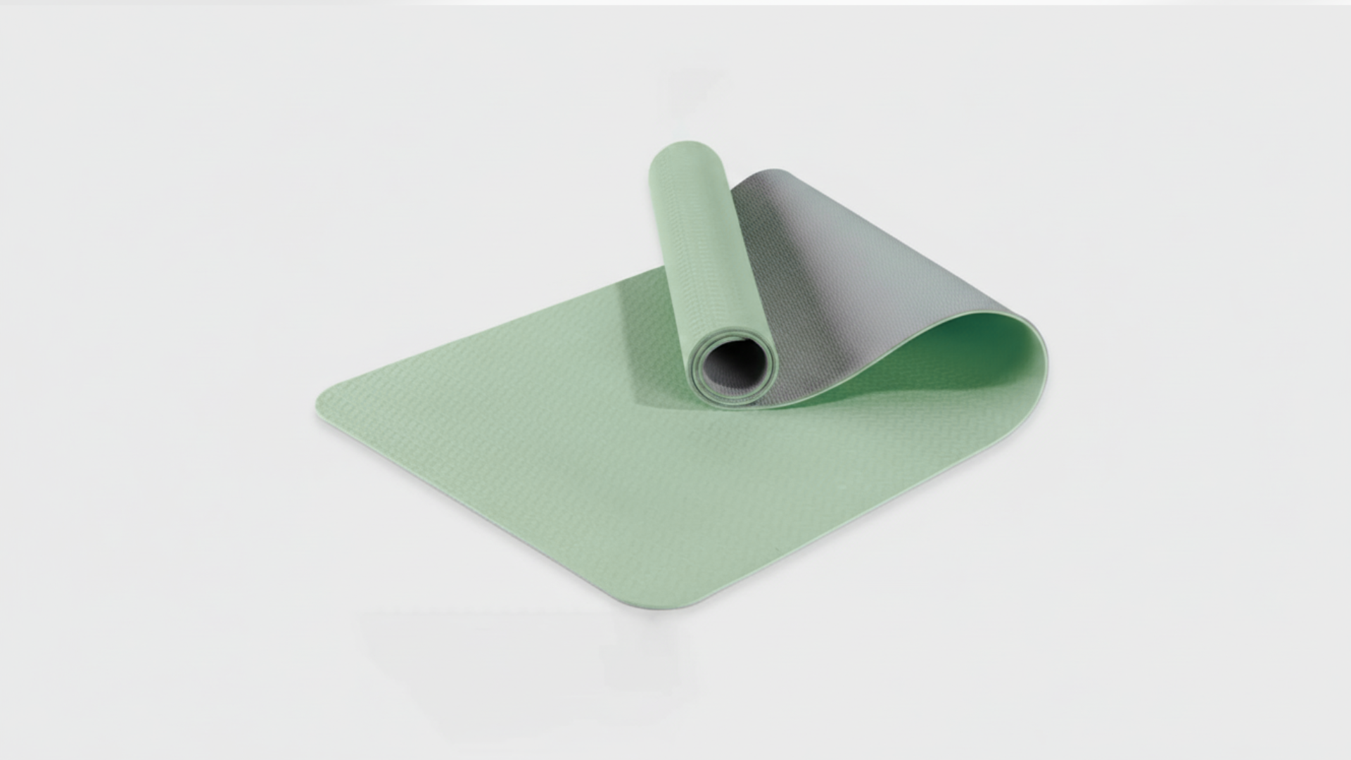 Green yoga mat with a white background