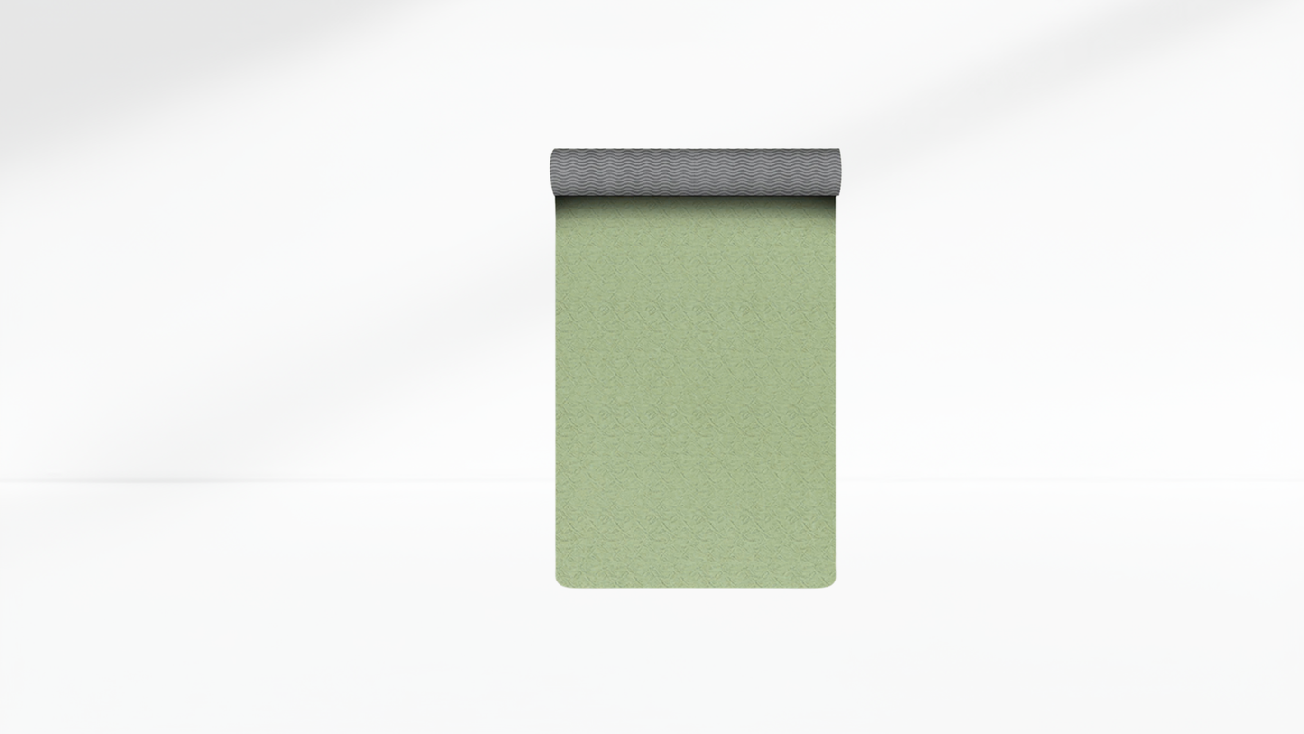 Green yoga mat with gray border on a white background