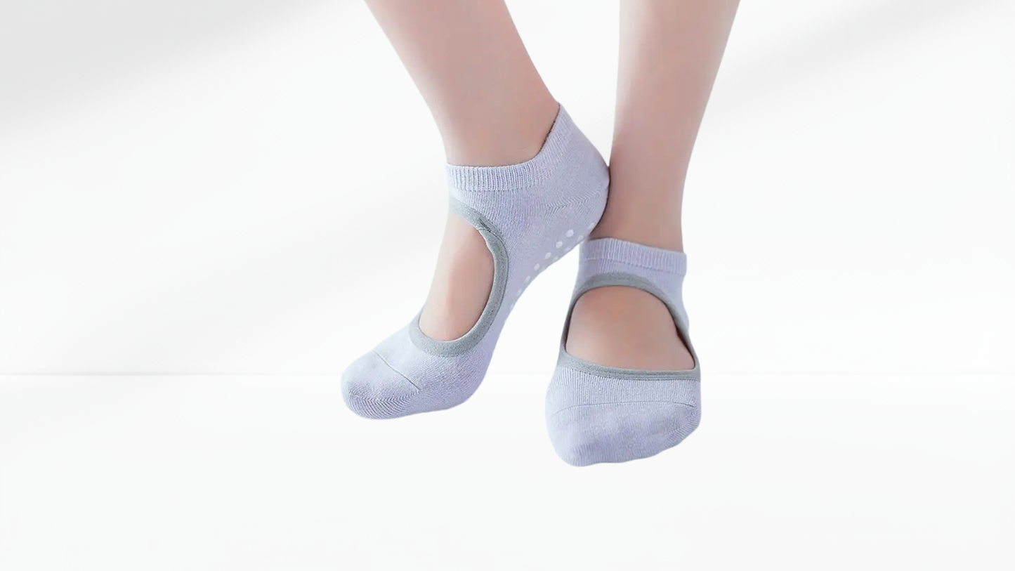 Light blue ankle grip socks worn by a person on a white background