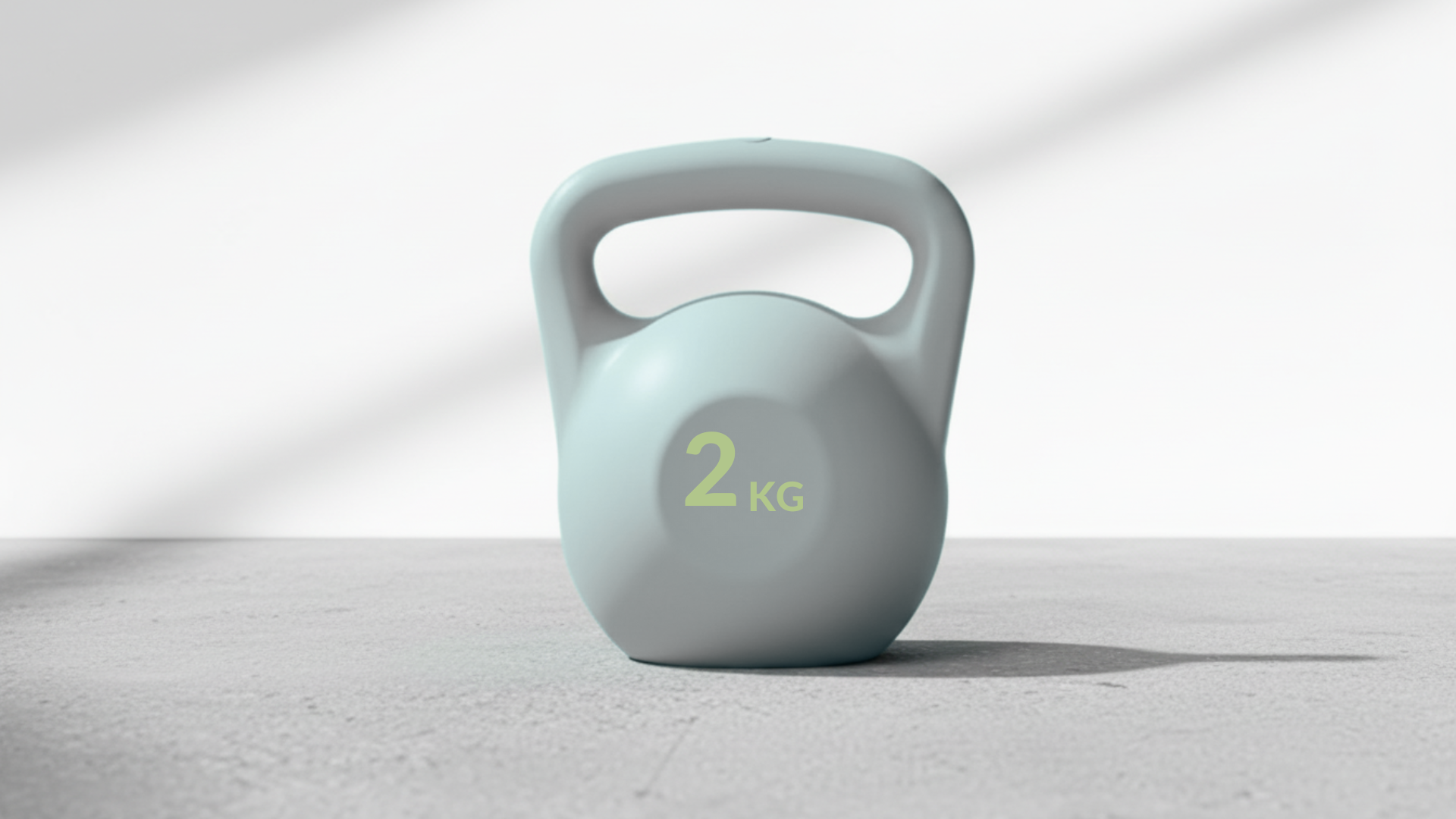 Light grey 2kg kettlebell on a light gray background