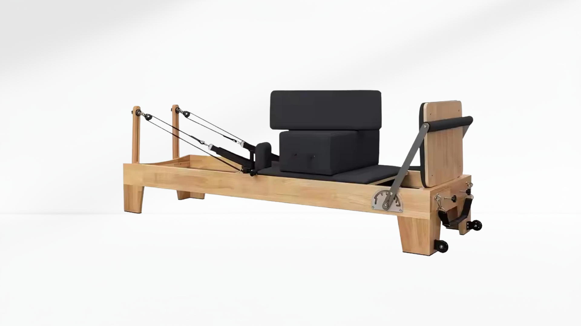 Oak Pilates reformer machine on a white background