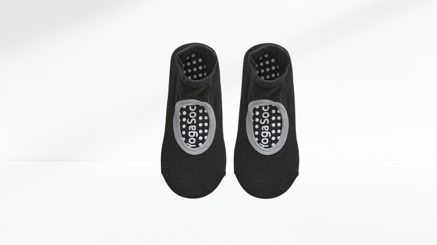 Pair of black grip socks with a logo on a white background