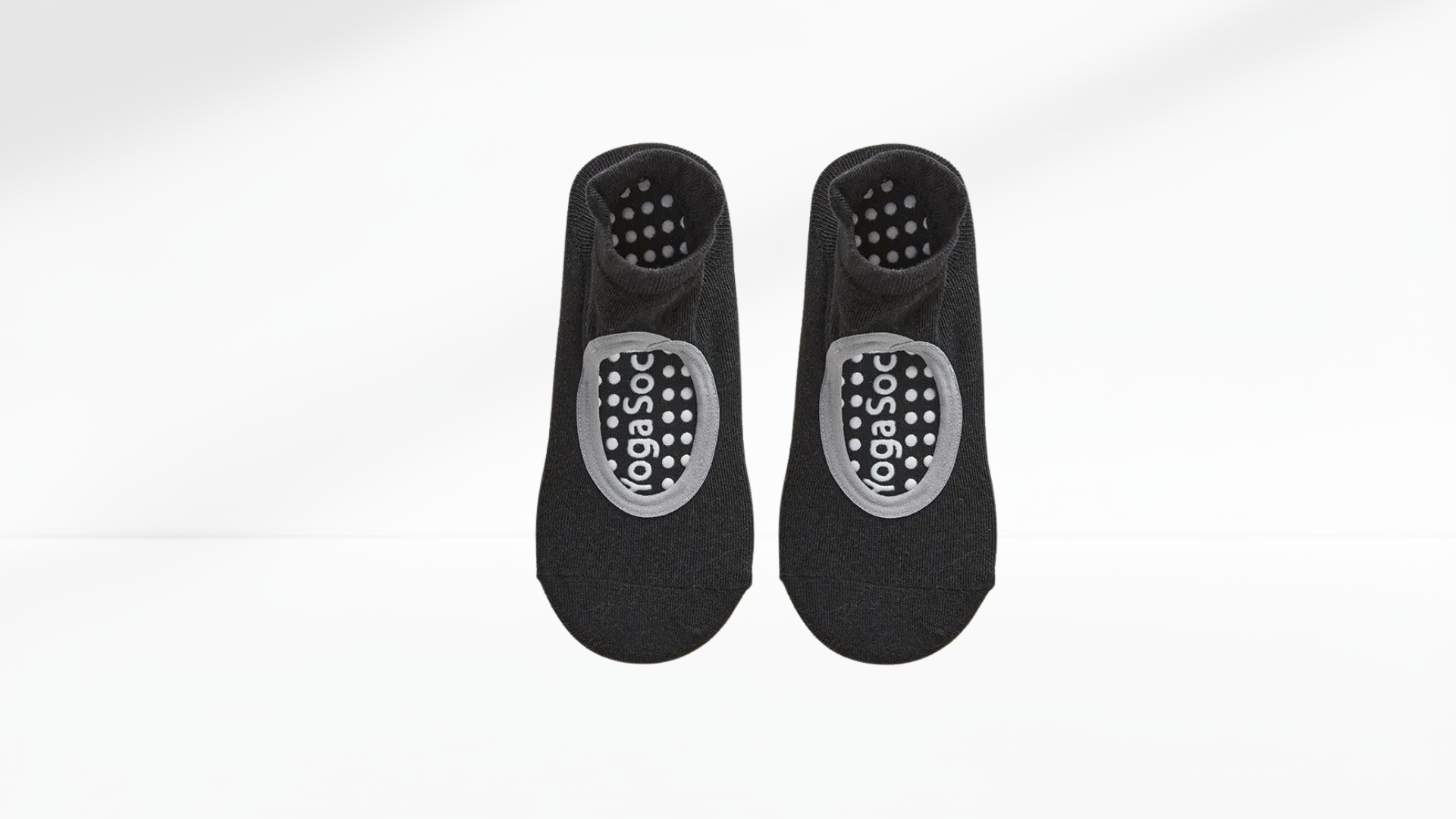 Pair of black grip socks with a logo on a white background