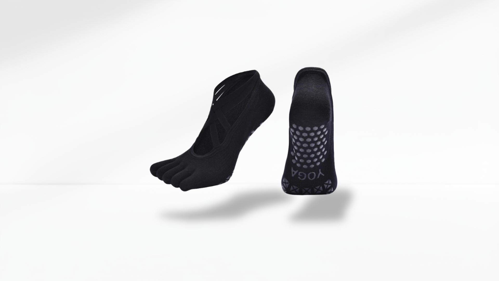 Pair of black toe sock running socks on a white background