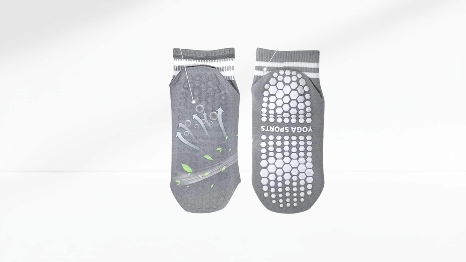 Pair of gray grip socks with acupressure dots on a white background