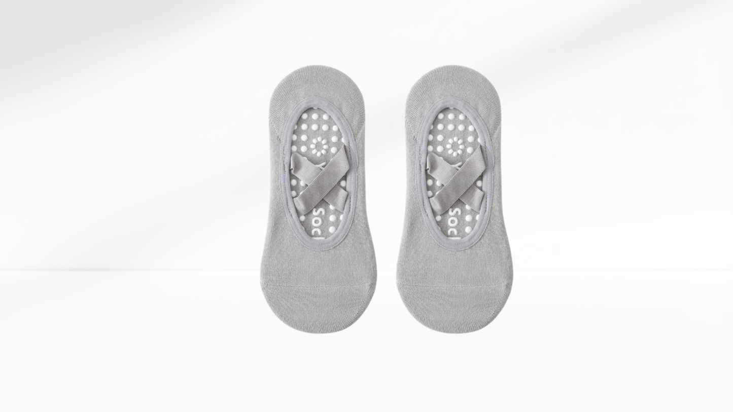 Pair of gray no-show grip socks ballet with sole protectors on a white background