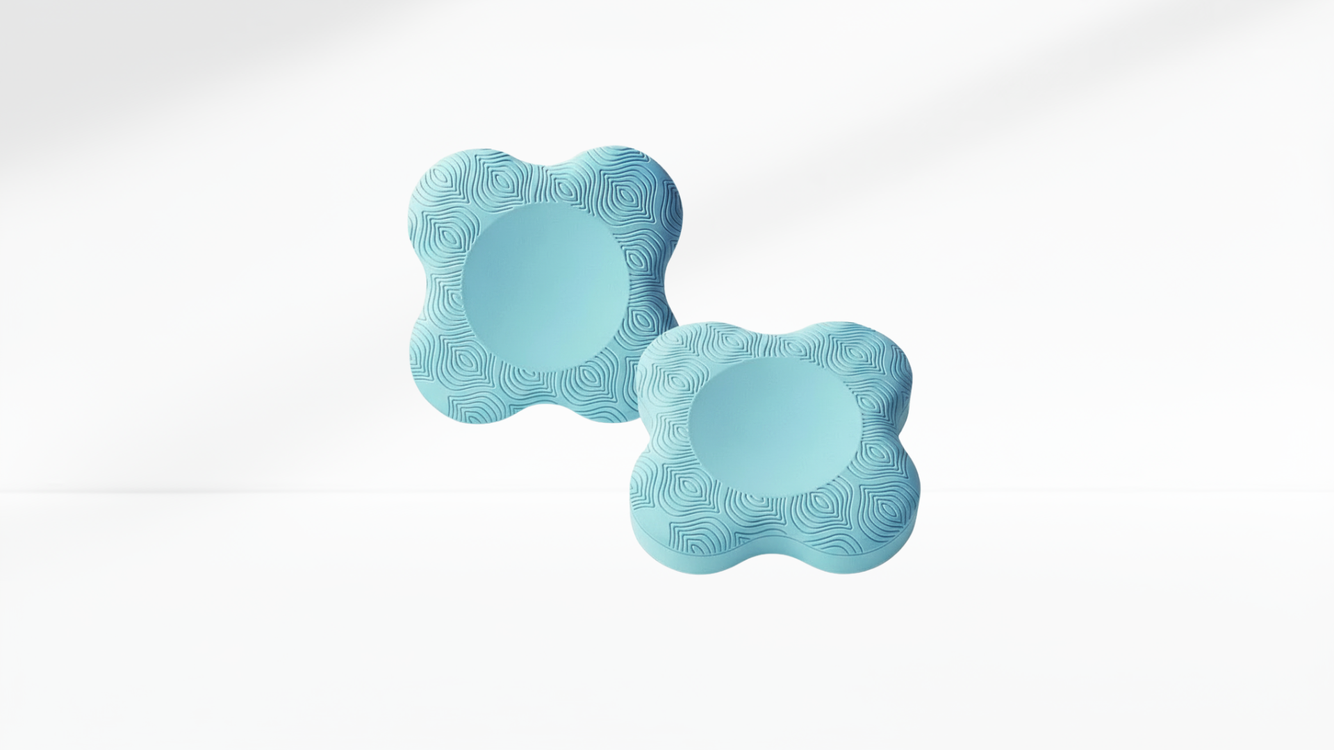 Pair of light-blue ergonomic elbow pads with textured surface, displayed on a clean white background.