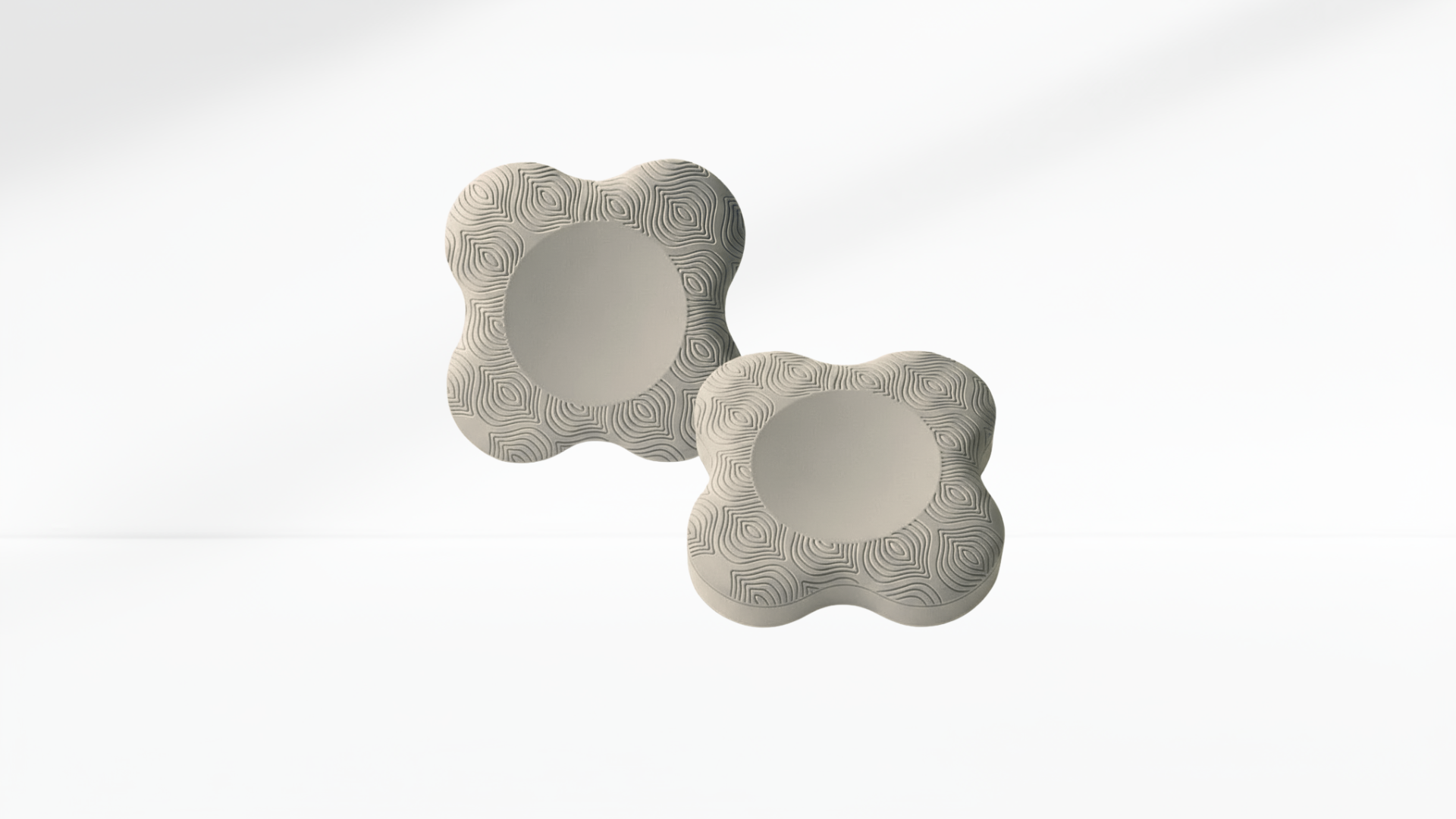 Pair of light-grey ergonomic elbow pads with textured surface, displayed on a clean white background.