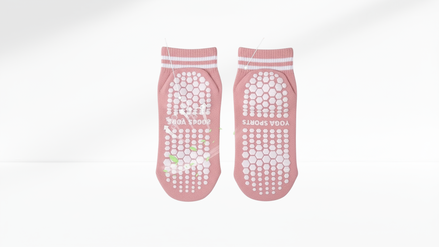 Pair of pink grip socks with textured sole 