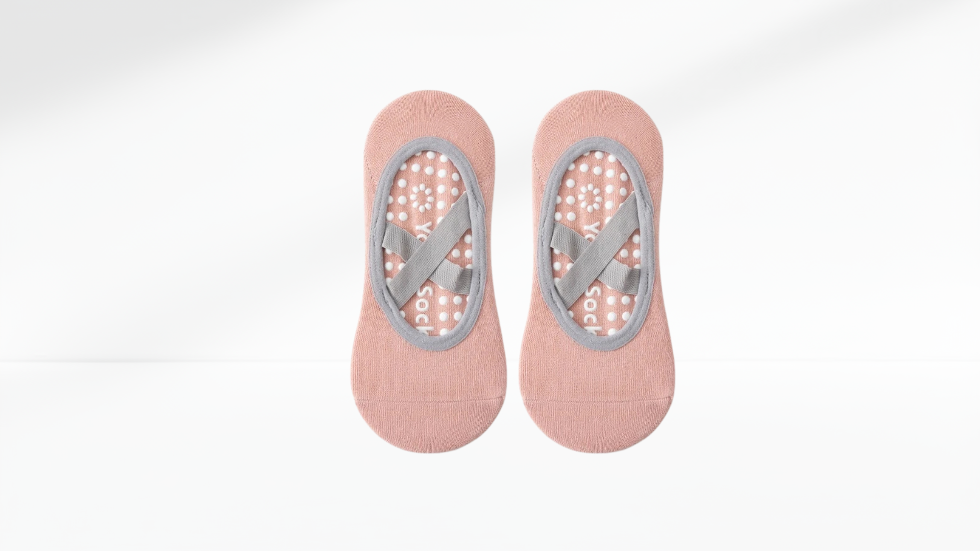 Pair of purple grip socks ballet with gray patterns on a white background