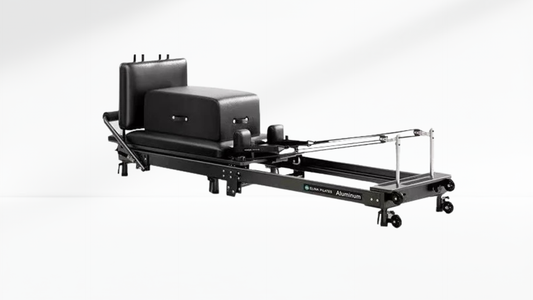 Pilates Reformer – Foldable with Box on a white background