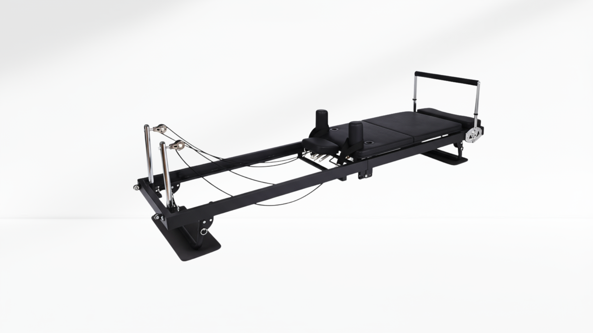 Pilates reformer machine on a white background