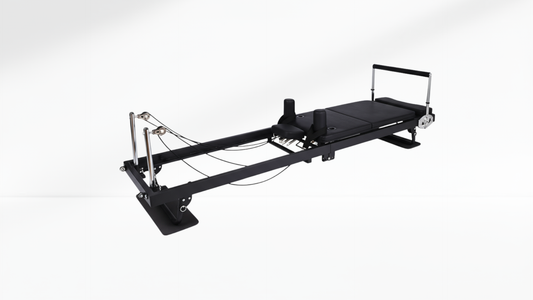 Pilates reformer machine on a white background