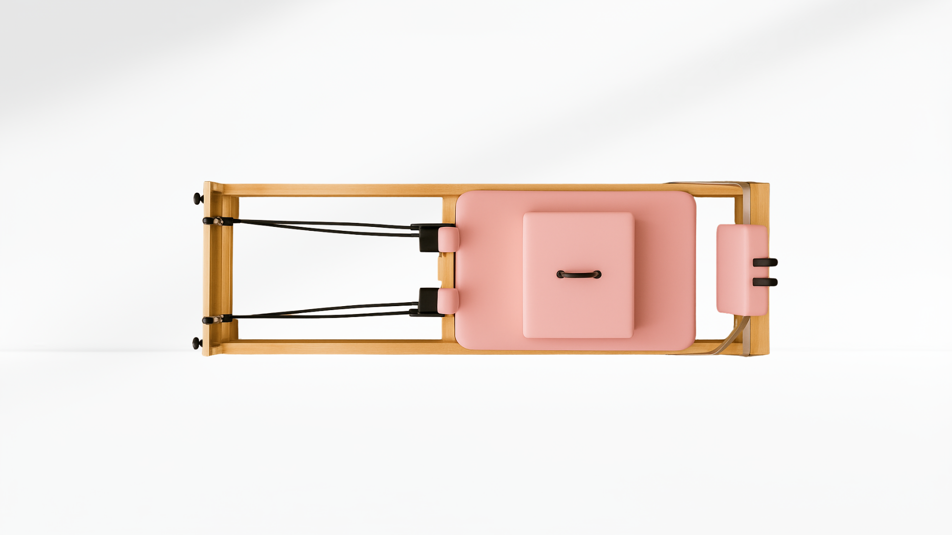 Pink and wooden pilates reformer on a white background