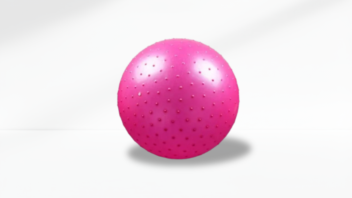 Pink exercise anti-slip ball with holes on a white background