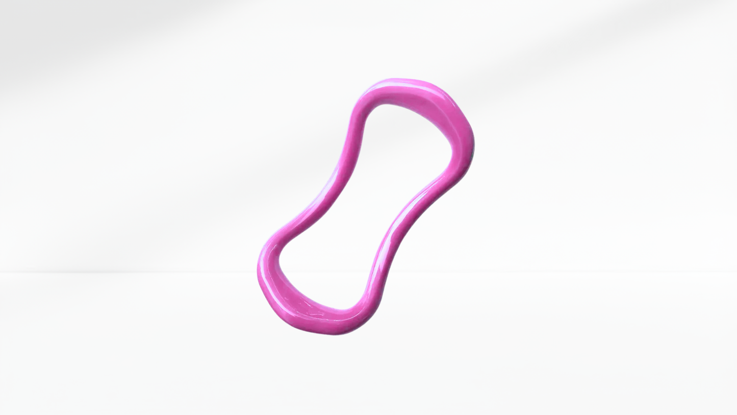 Pink pilates ring on a white-grey background