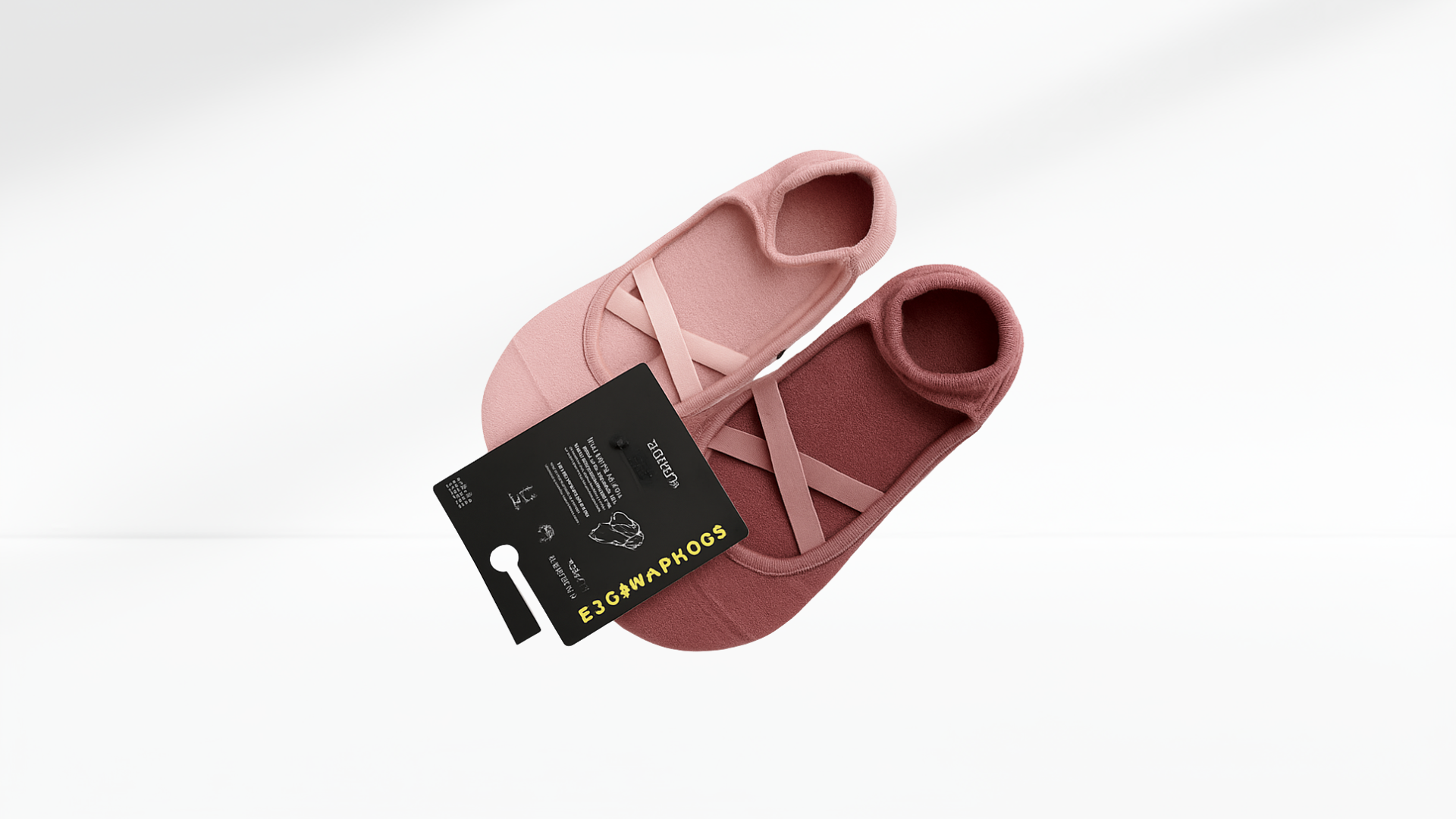 Pink slip-on Grip Socks – Ballet Mary Jane with a black tag on a white background