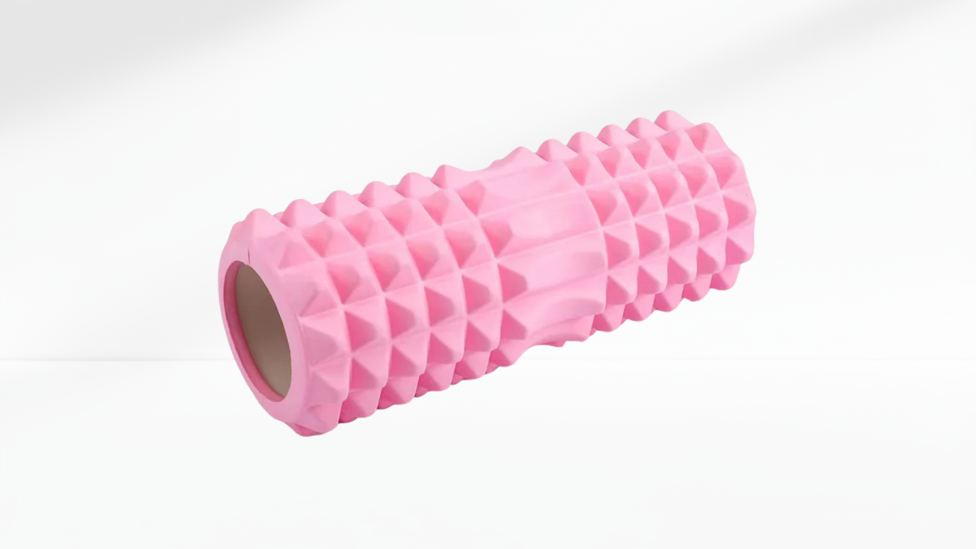 Pink textured EVA Foam Roller on a white background