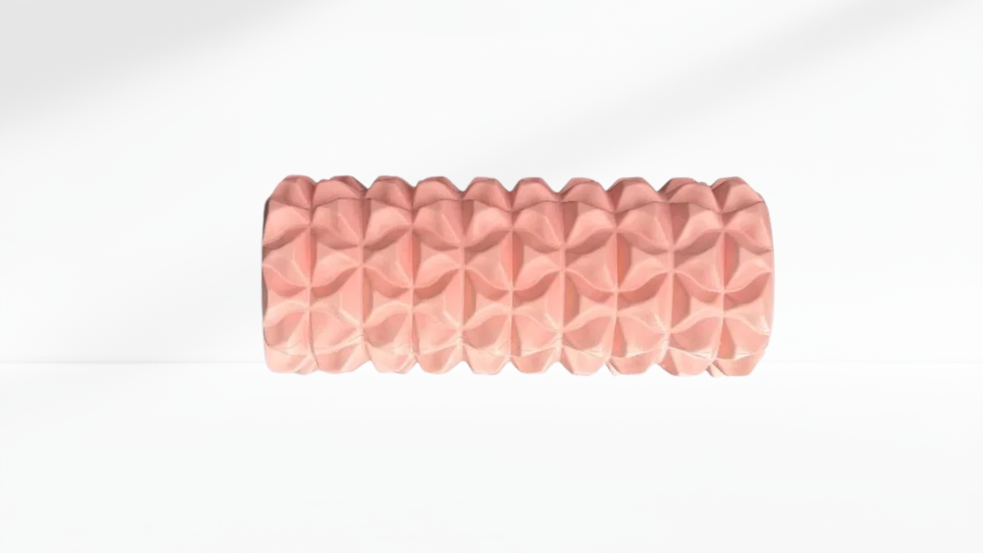 Pink textured Electric Vibrating Foam Roller on a white background