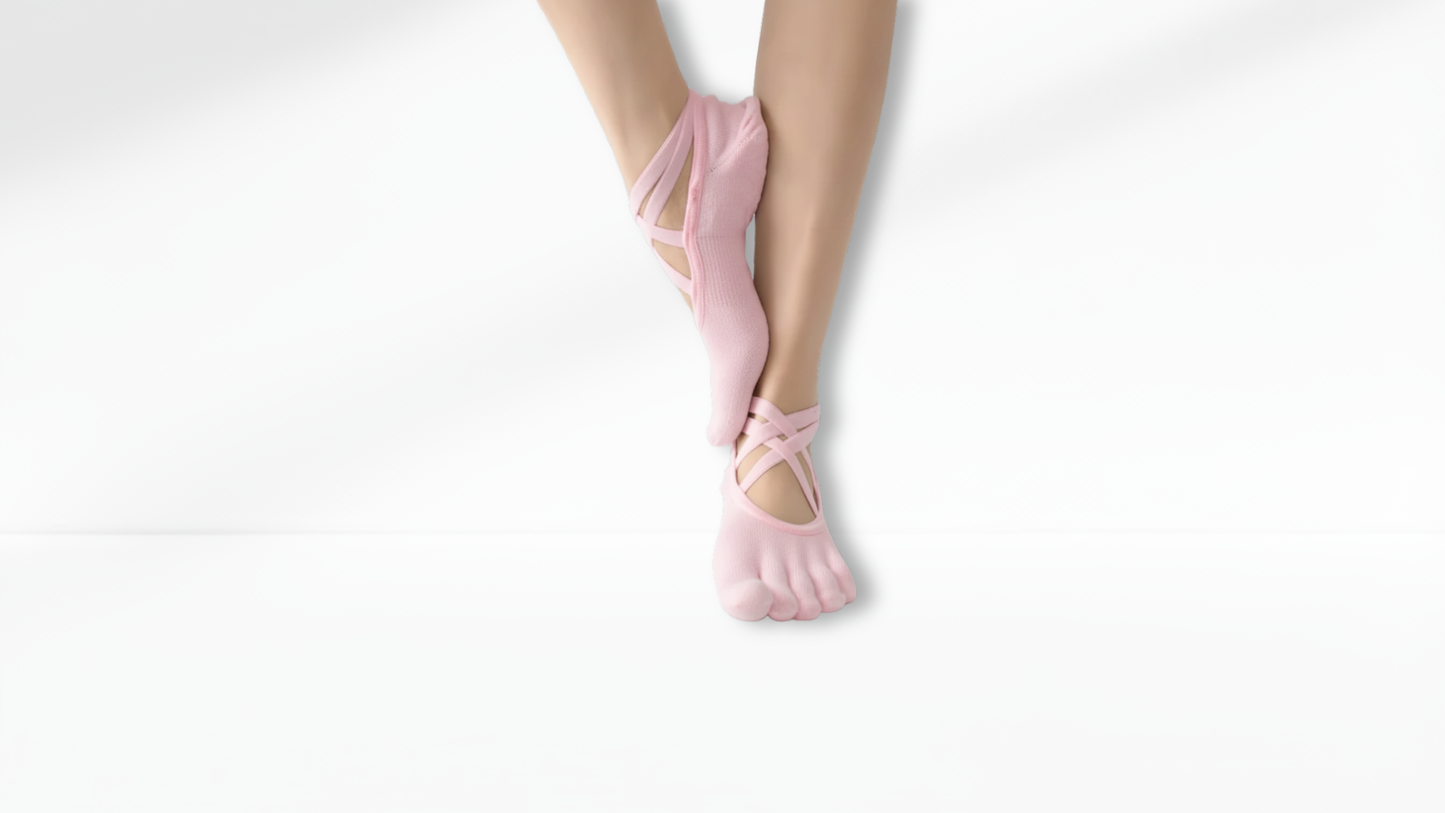 Pink toe socks worn by a person on a white background
