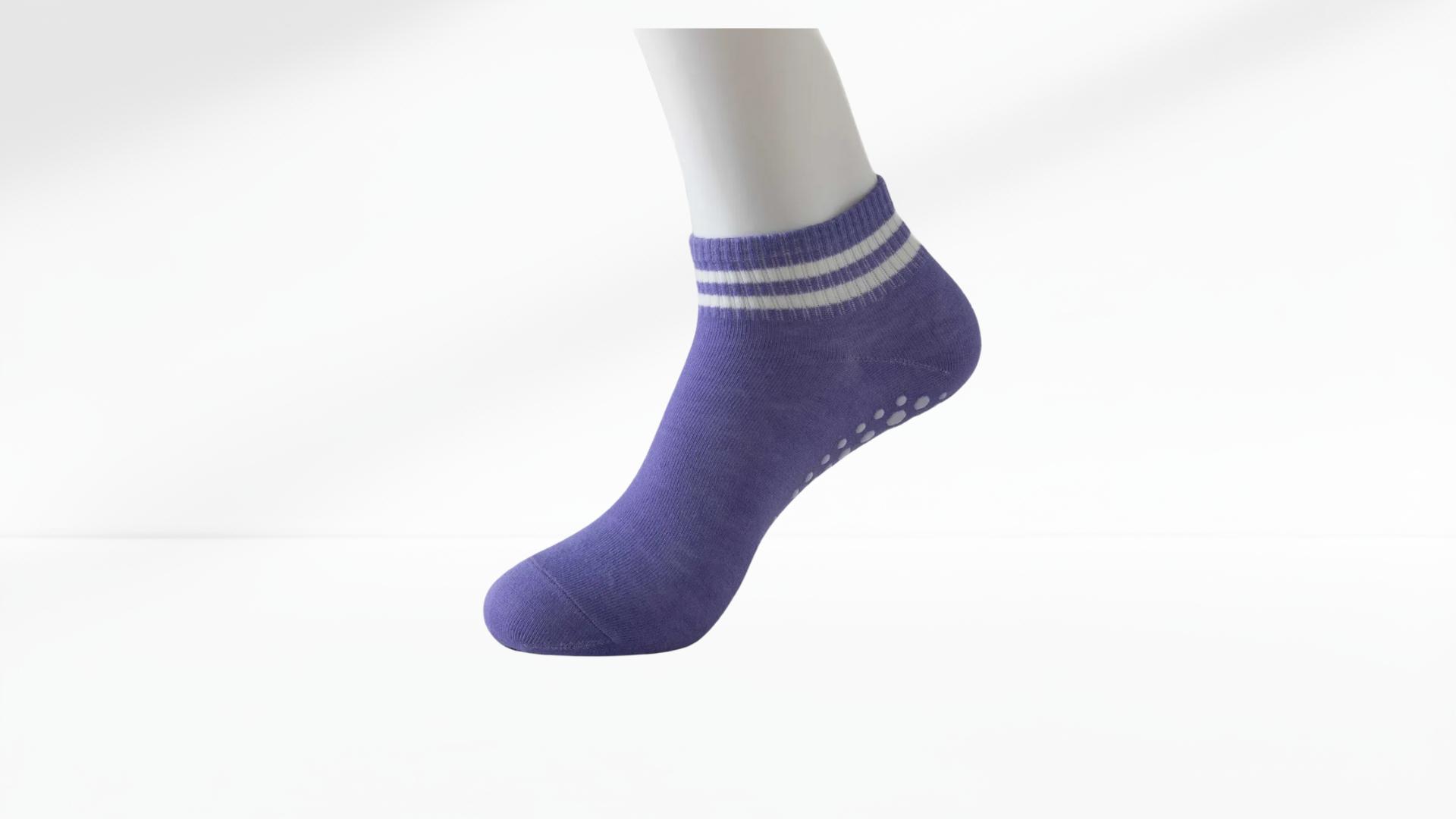 Purple ankle grip sock with white stripes on a white background