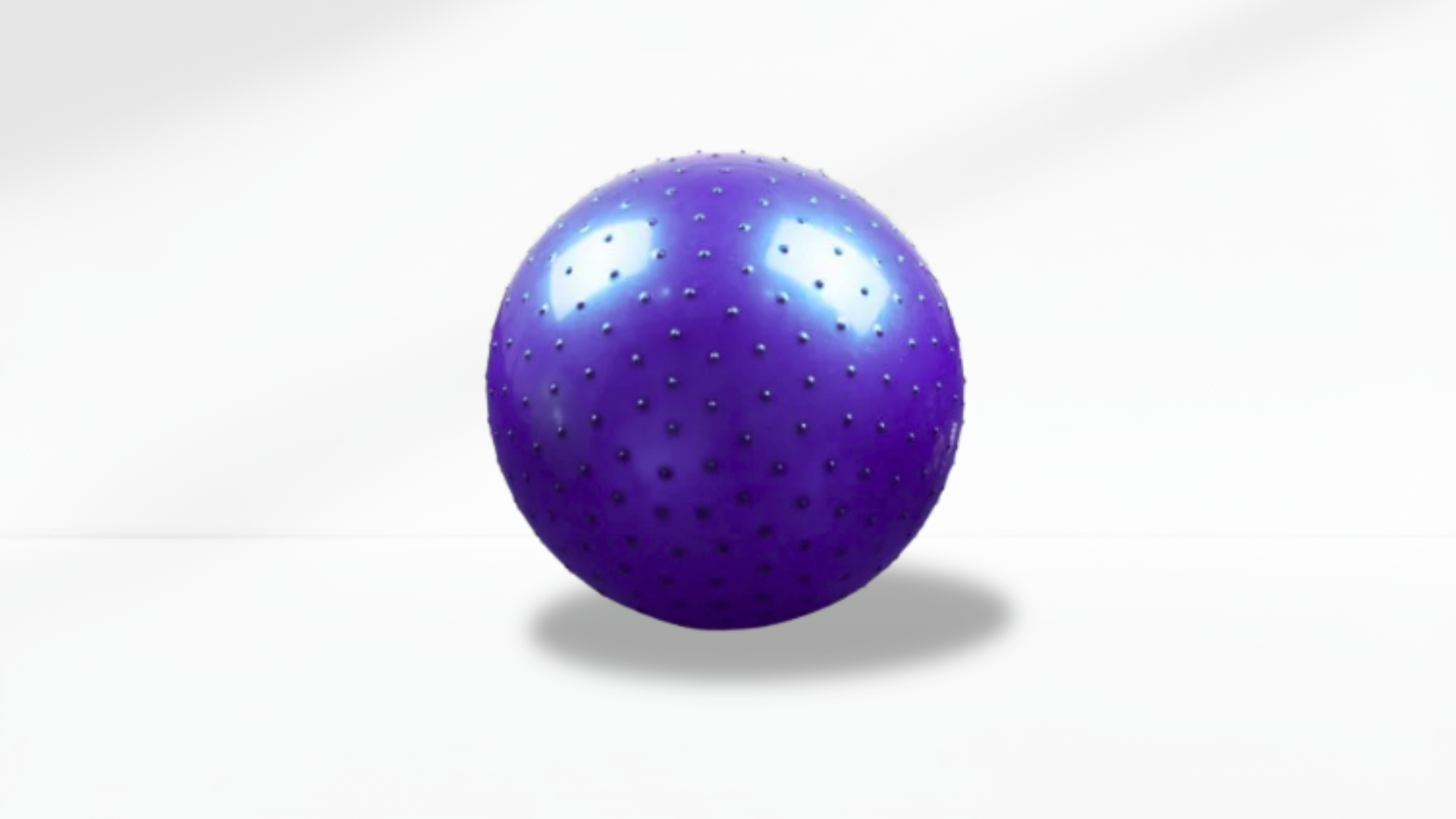 Purple anti-slip ball with holes on a white background