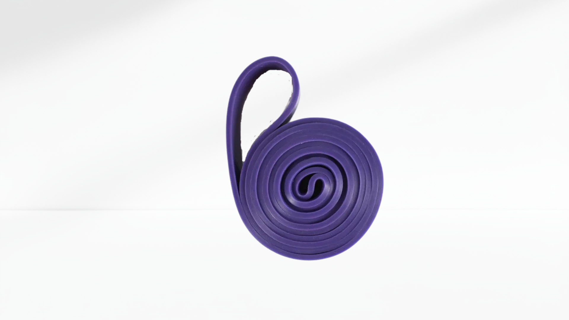 Purple resistance band on a white background
