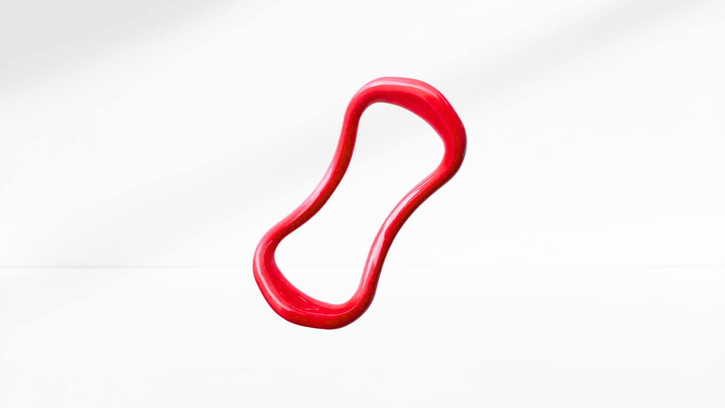 Red pilates ring on a white-grey background