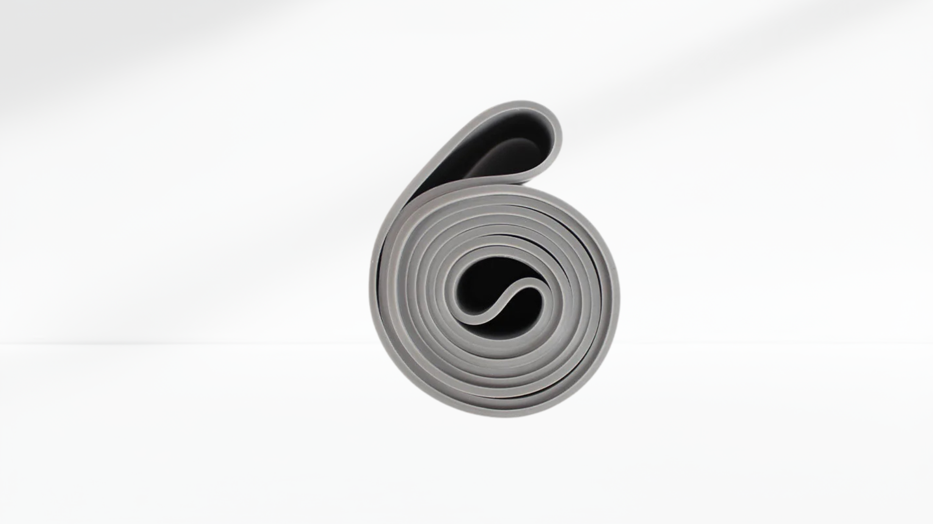 Roll of gray Resistance Band Latex Elastic  on a white background